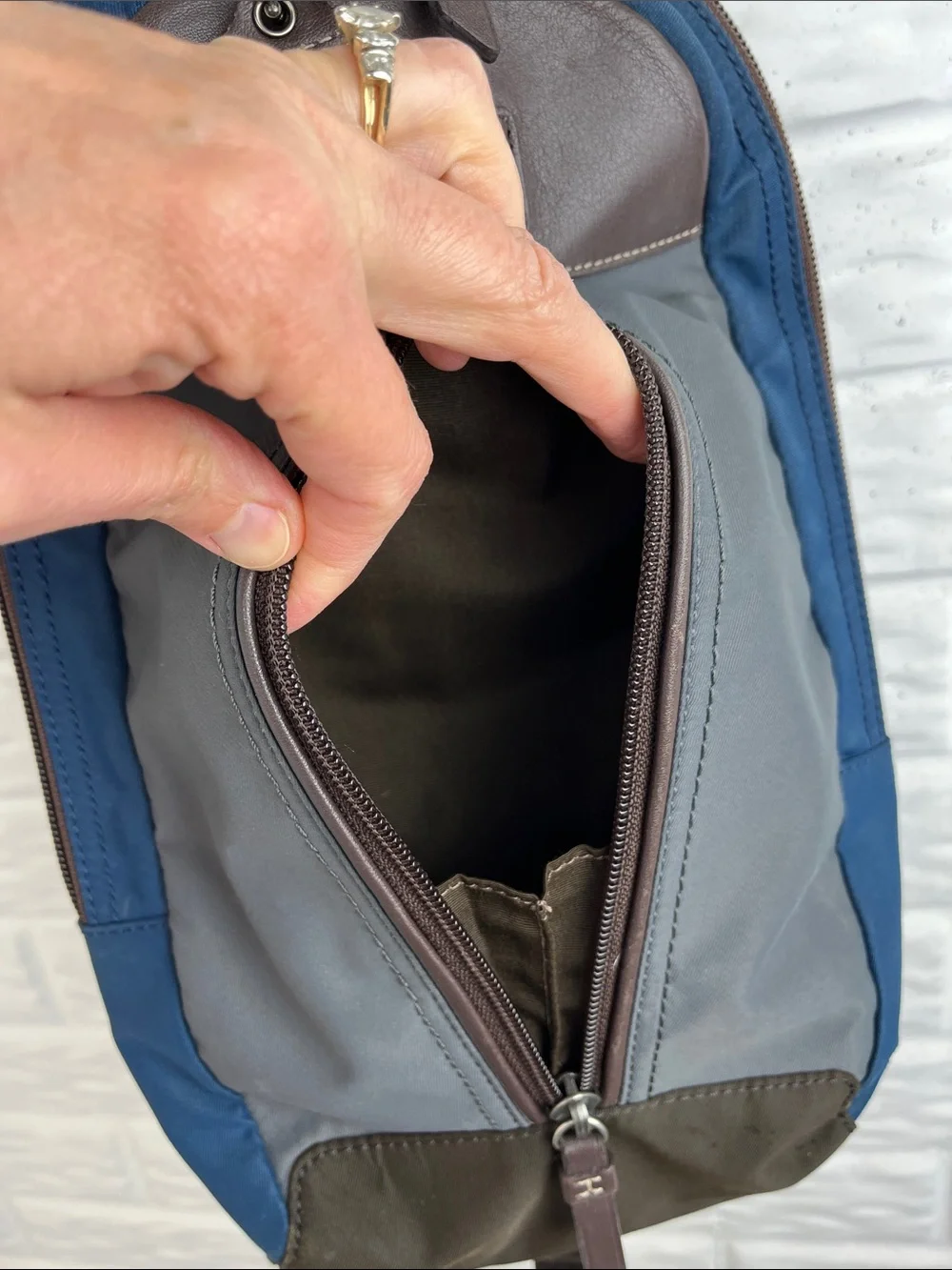 COACH Varick sling bag in navy blue / gray nylon with brown leather trim
